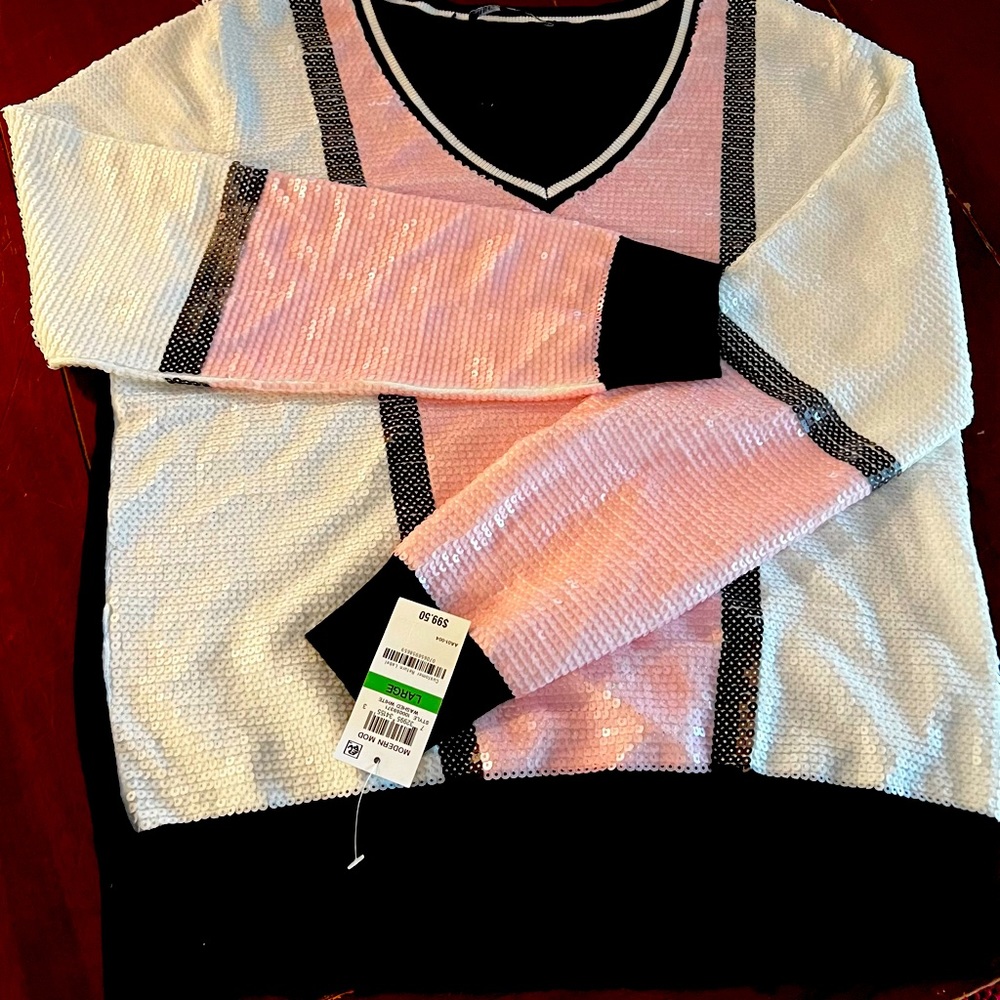 Sequin V neck sweater. Pink, white sequin front. Solid black back.